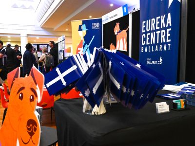 Community members viewing displays and exhibits at the Eureka Centre Ballarat stall during the Let’s Chat Ballarat 2026 Community Expo.