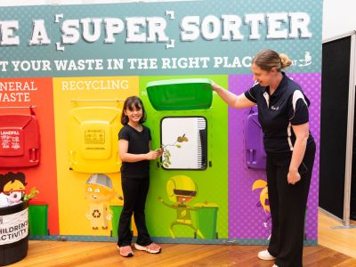Child participating in the Sustainable Environment Team’s Super Sorter waste education activity during the Let’s Chat Ballarat 2026 Community Expo. 
